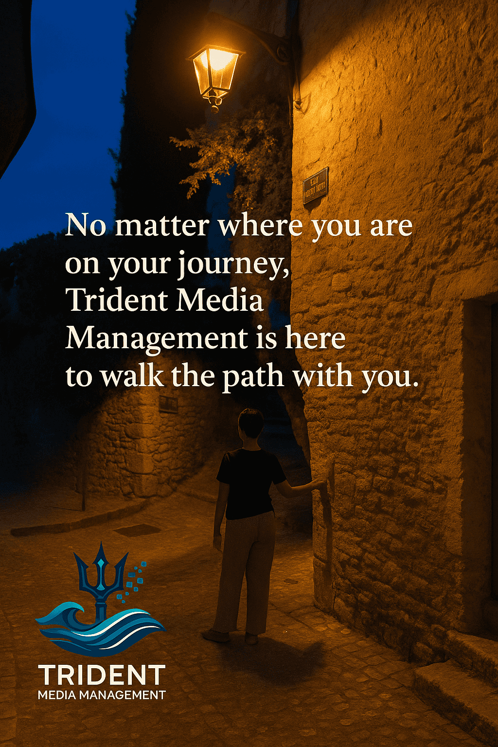 Stone pathway with streetlamp and quote: No matter where you are on your journey, Trident Media Management is here to walk the path with you