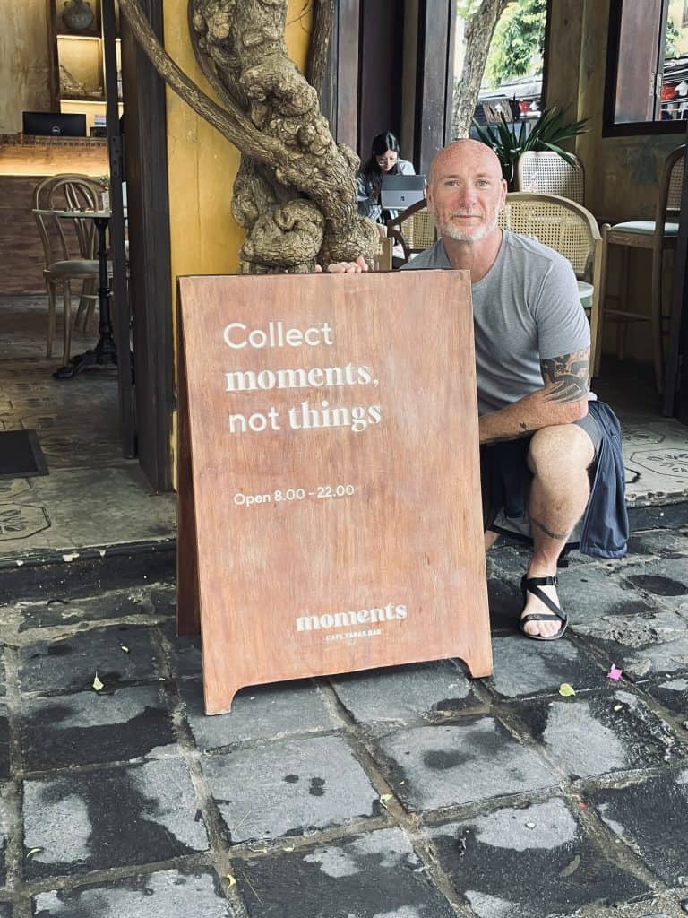 Sign on sidewalk with message Make Moments | Trident Media Management brandin